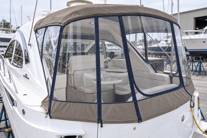 The same cockpit with a new crystal clear vinyl enclosure with navy trim and new zippers