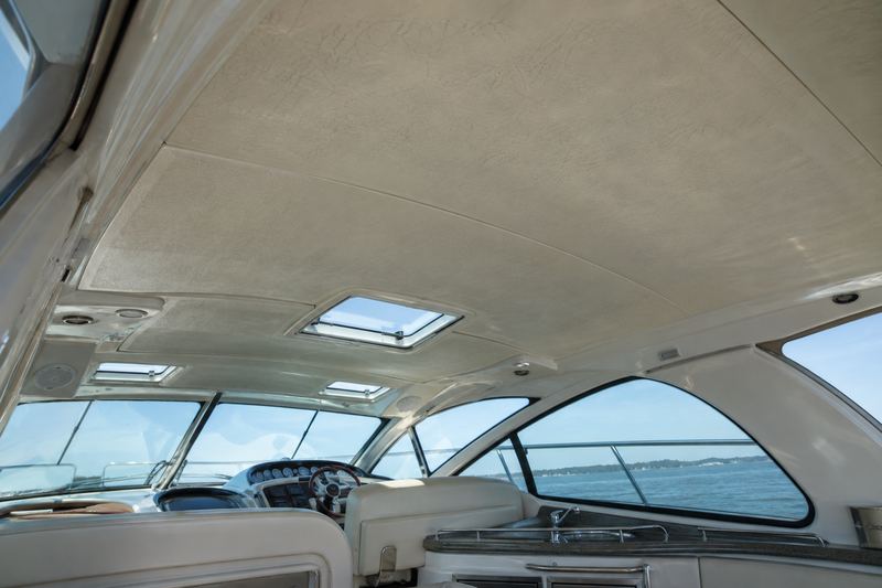 Cabin of a 40 ft express cruiser with a sagging, stained, bubbled headliner